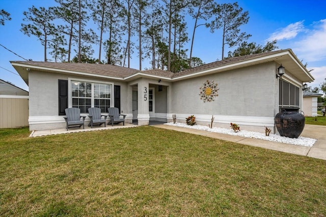 view of front of home featuring a front yard