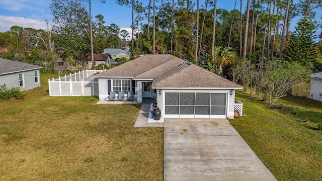 view of front of house with a front lawn and a garage