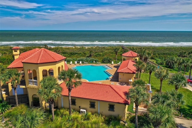 aerial view featuring a water view and a view of the beach