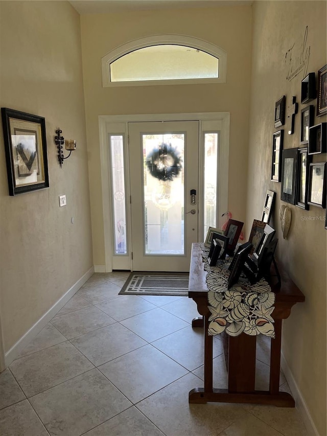 foyer entrance featuring light tile patterned flooring