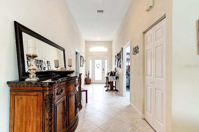 hallway featuring light tile patterned floors