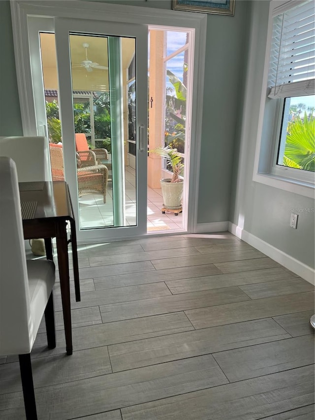 doorway to outside featuring plenty of natural light and light wood-type flooring