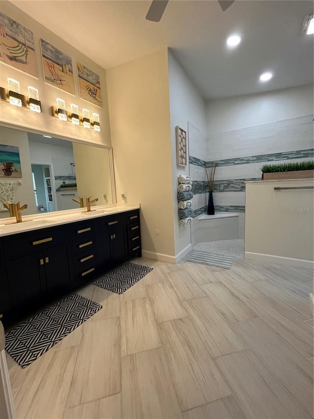 bathroom with vanity and a shower