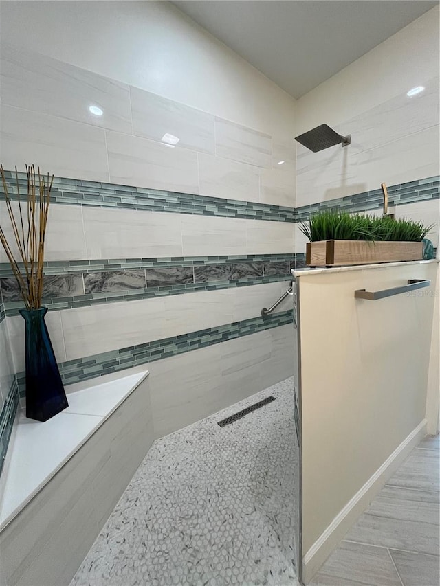 bathroom with tiled shower