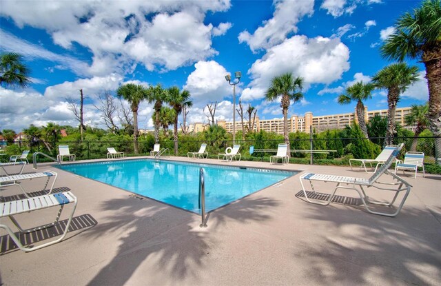 view of swimming pool with a patio area