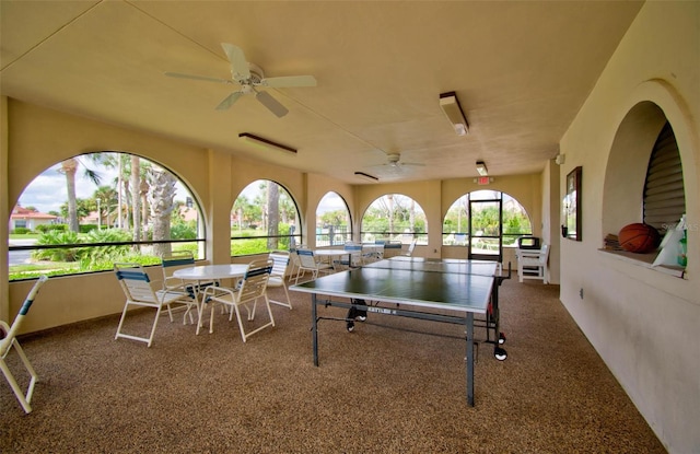 rec room with ceiling fan and carpet floors