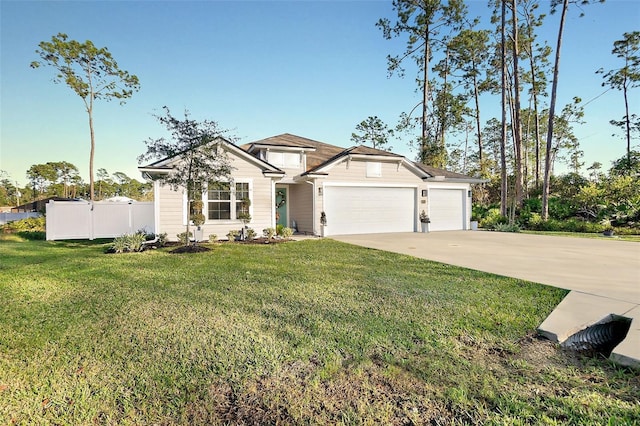 view of front of property featuring a garage and a front lawn