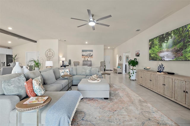 living room with vaulted ceiling with beams, ceiling fan, and light tile patterned flooring