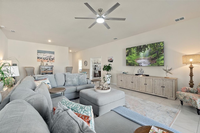 tiled living room featuring ceiling fan