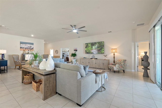 living room with ceiling fan and light tile patterned floors