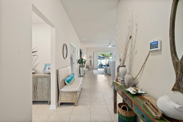 hall with light tile patterned floors