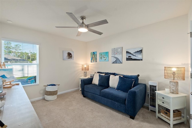 carpeted living room featuring heating unit and ceiling fan