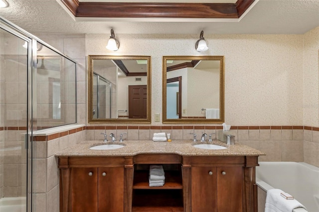 bathroom with vanity, ornamental molding, and shower with separate bathtub