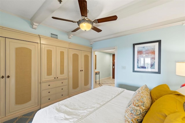 bedroom featuring beamed ceiling, a closet, ceiling fan, and ornamental molding