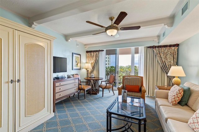 living room with beam ceiling, ceiling fan, and a textured ceiling