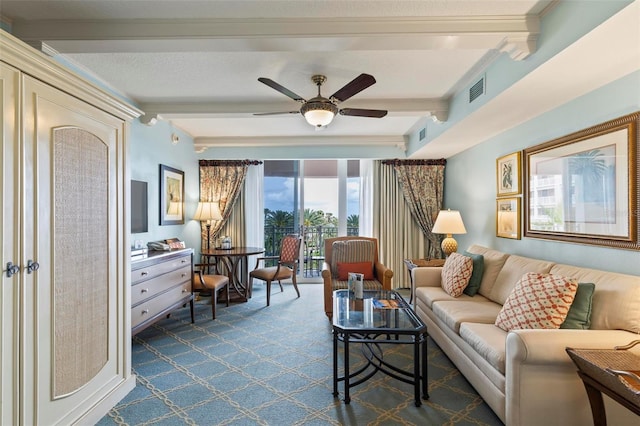 carpeted living room featuring ceiling fan and beam ceiling