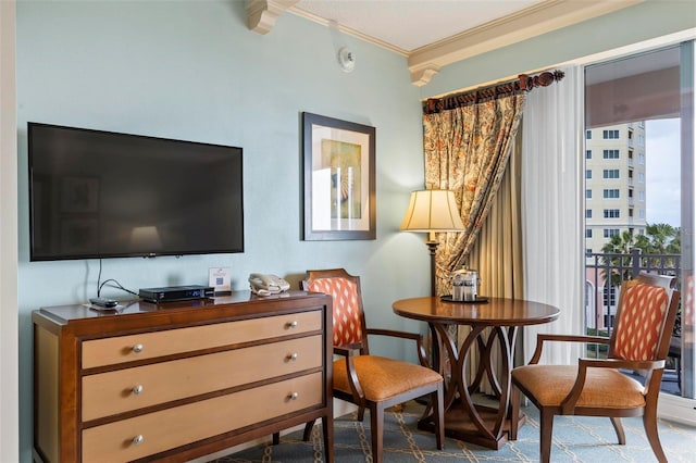 living area featuring ornamental molding