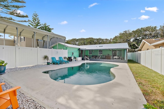 view of pool featuring a patio area