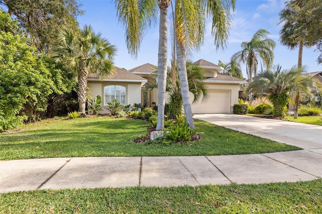 view of front facade featuring a garage and a front yard