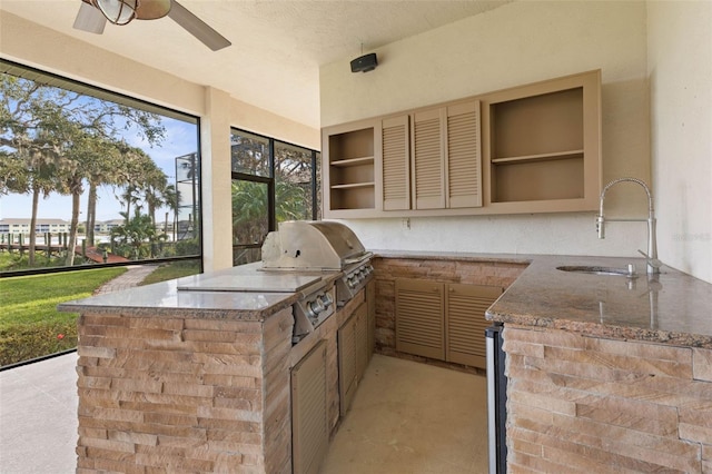 view of patio / terrace featuring area for grilling, ceiling fan, and sink