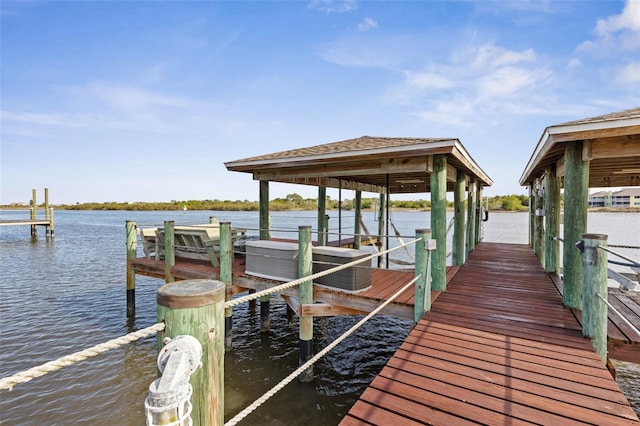 dock area featuring a water view