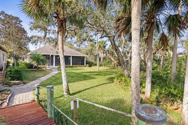 view of yard with a sunroom