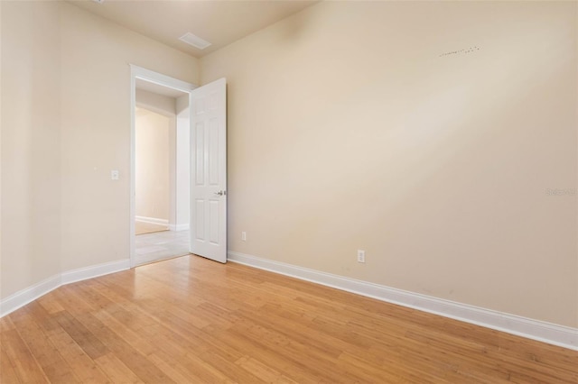 unfurnished room featuring light hardwood / wood-style flooring