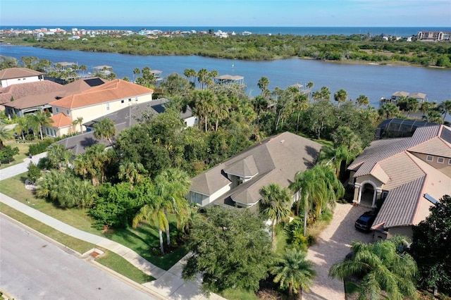 birds eye view of property with a water view