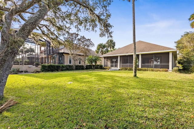 view of yard featuring a sunroom