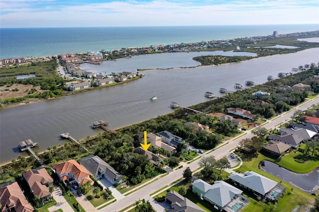 birds eye view of property featuring a water view