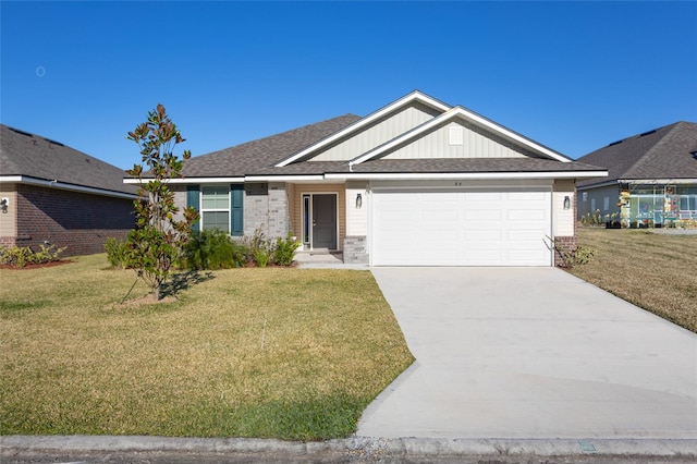 view of front facade with a front yard and a garage