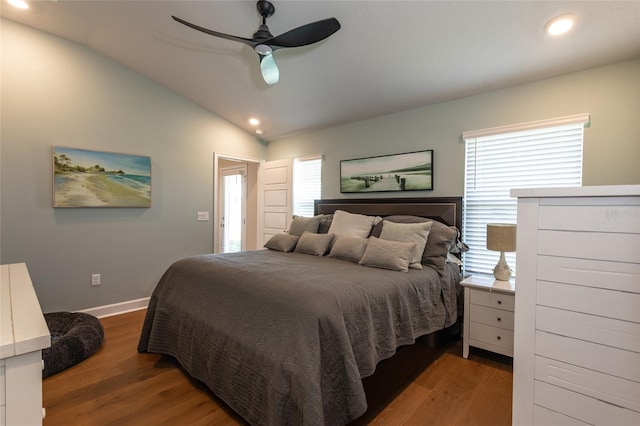 bedroom featuring hardwood / wood-style floors, ceiling fan, and lofted ceiling