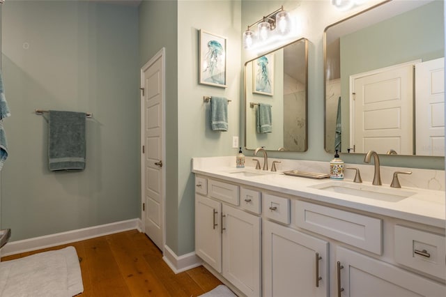 bathroom with vanity and hardwood / wood-style flooring