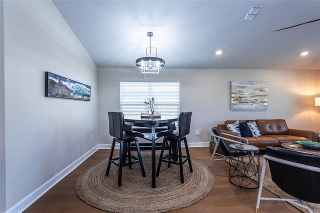 dining space featuring dark wood-type flooring