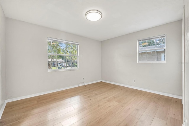 unfurnished room with light hardwood / wood-style floors