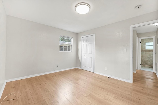 unfurnished room featuring light hardwood / wood-style flooring