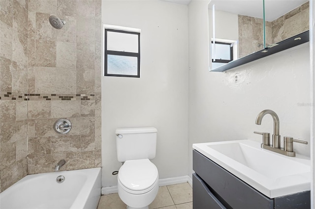 full bathroom with tile patterned flooring, vanity, toilet, and tiled shower / bath combo