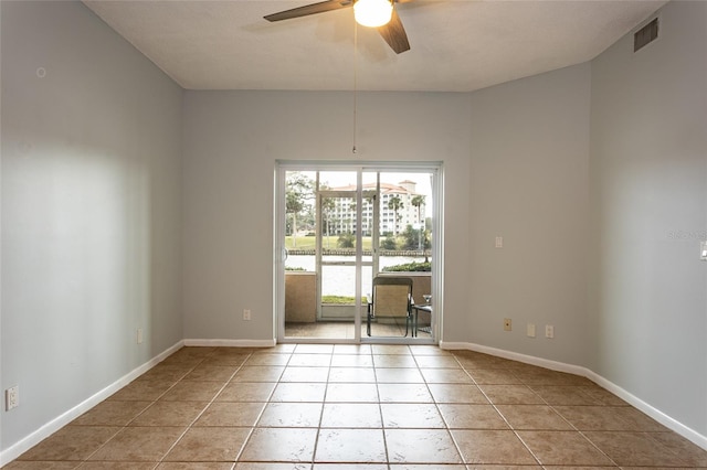 unfurnished room with light tile patterned floors and ceiling fan