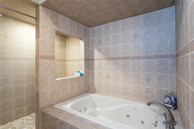 bathroom with shower with separate bathtub and tile walls