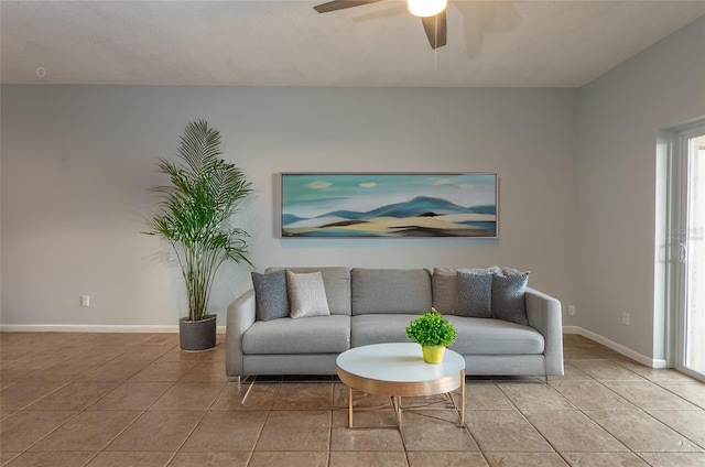 living room featuring light tile patterned floors and ceiling fan