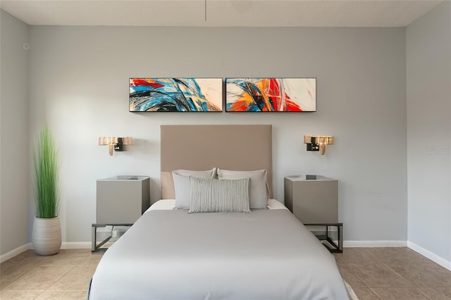 bedroom with light tile patterned floors