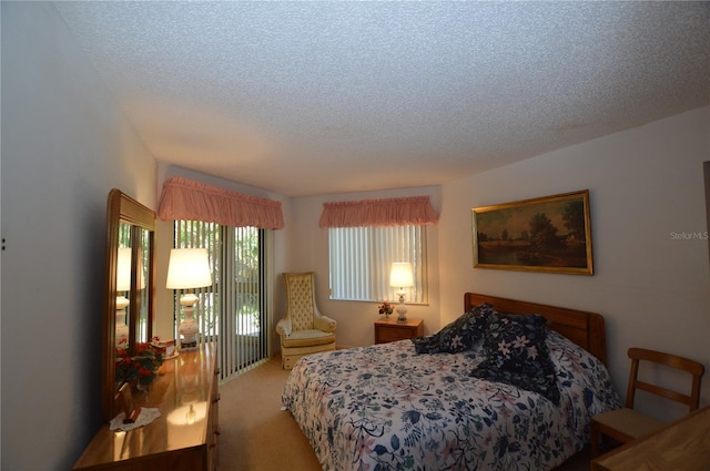 carpeted bedroom with a textured ceiling