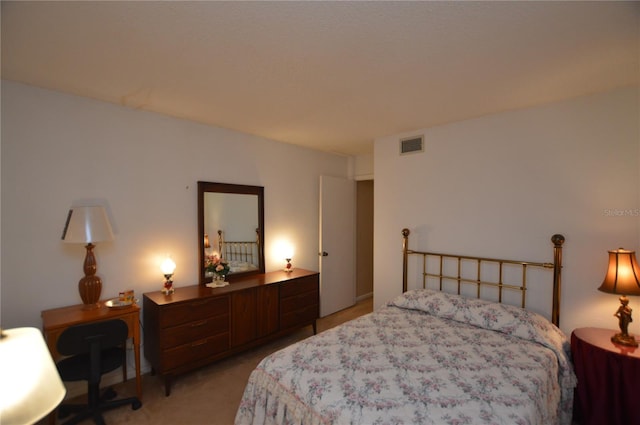 bedroom featuring light carpet