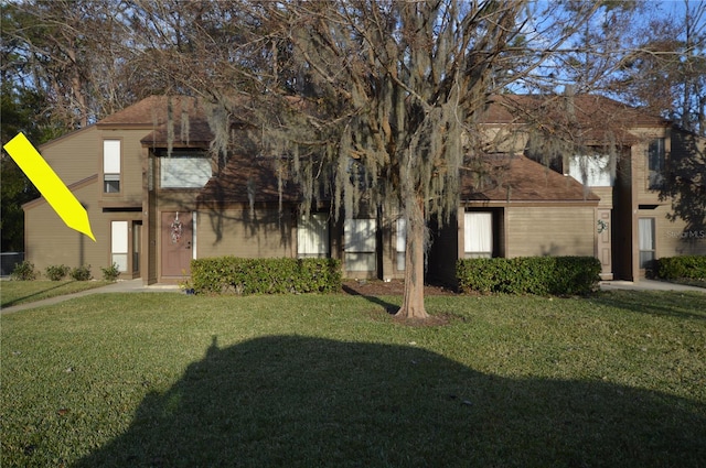 view of front of home with a front lawn