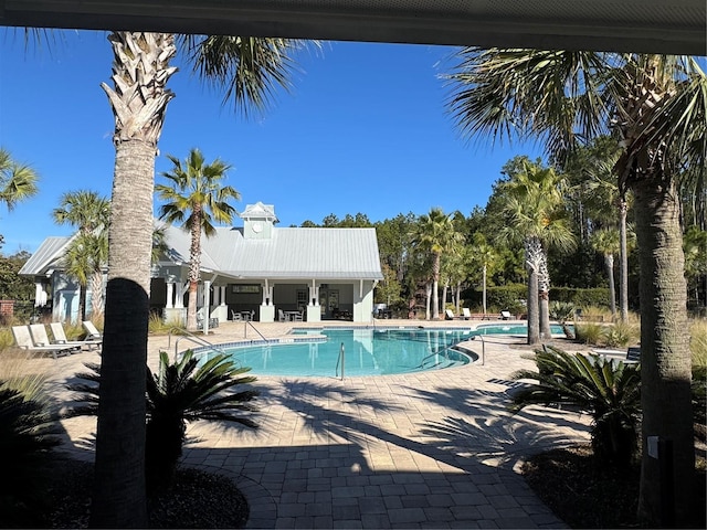 view of swimming pool featuring a patio area