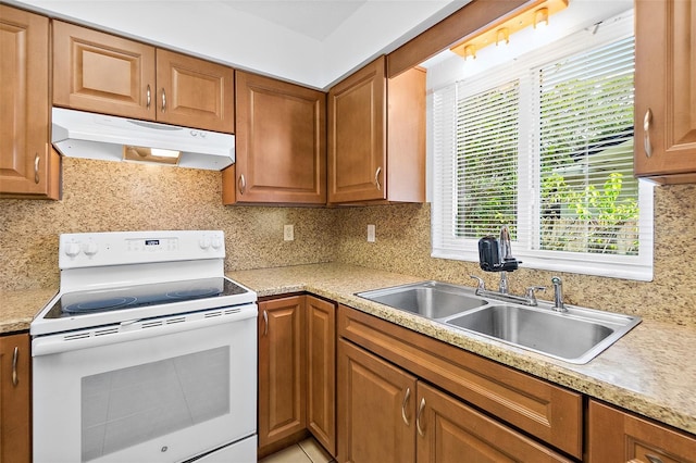 kitchen with decorative backsplash, sink, and white electric stove