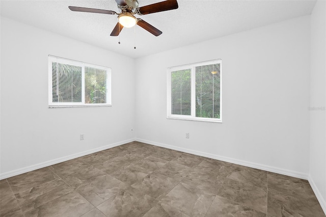 spare room featuring ceiling fan