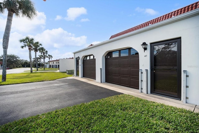 garage with a yard