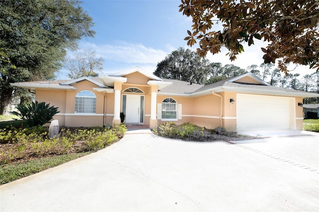 single story home featuring a garage