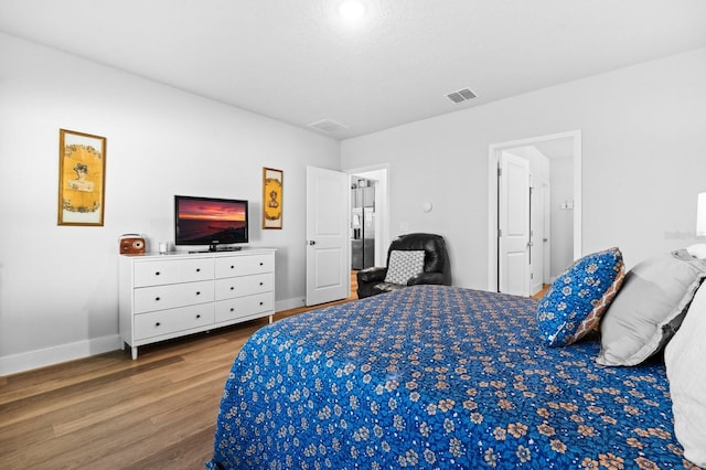 bedroom featuring hardwood / wood-style flooring